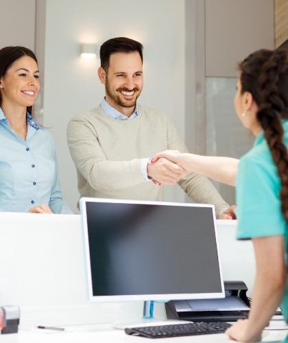 patients shaking hands with team member